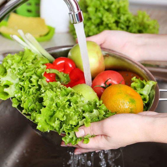 Vegetables washing in the kitchen